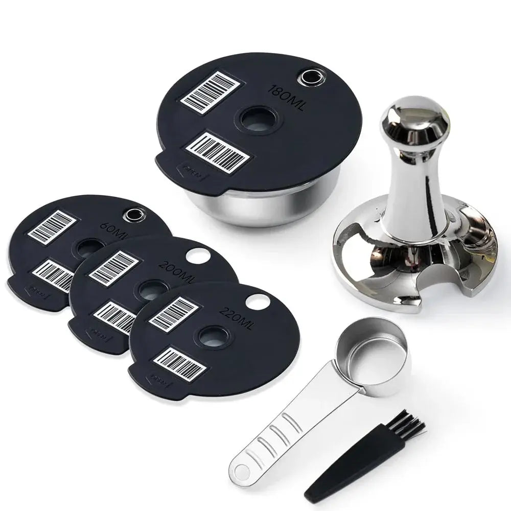 Set of black measuring cups with silver lids and a metal scoop on a white background